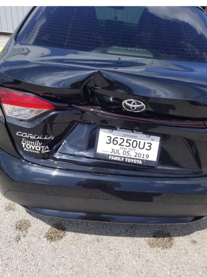 Toyota Corolla with rear collision damage before repair at Raymond's Paint & Body, Crowley TX