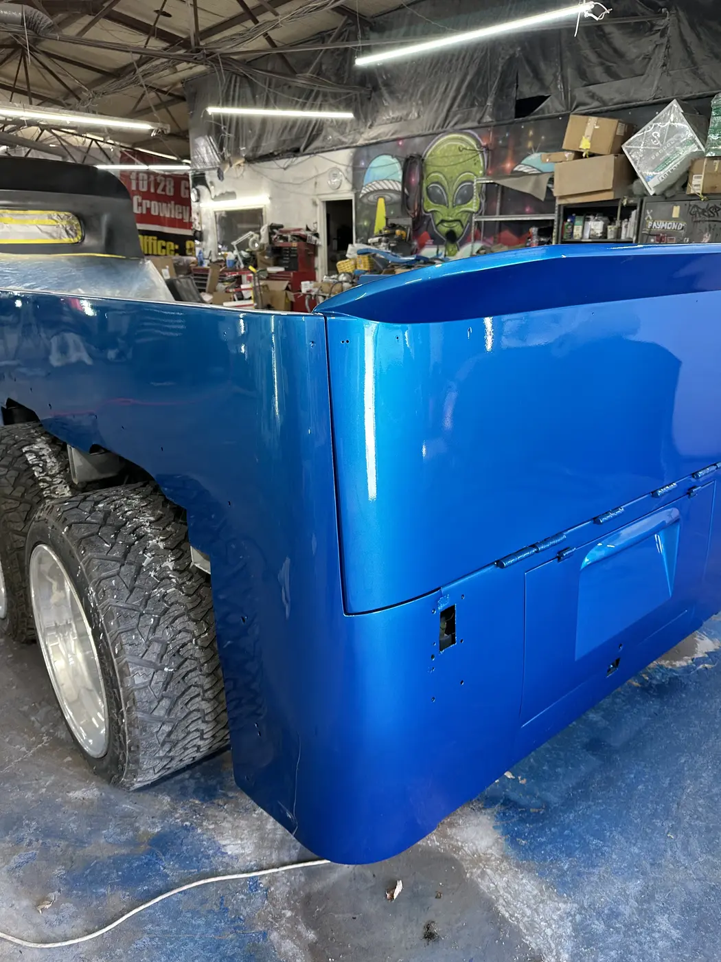Custom hauler bed receiving its blue finish
