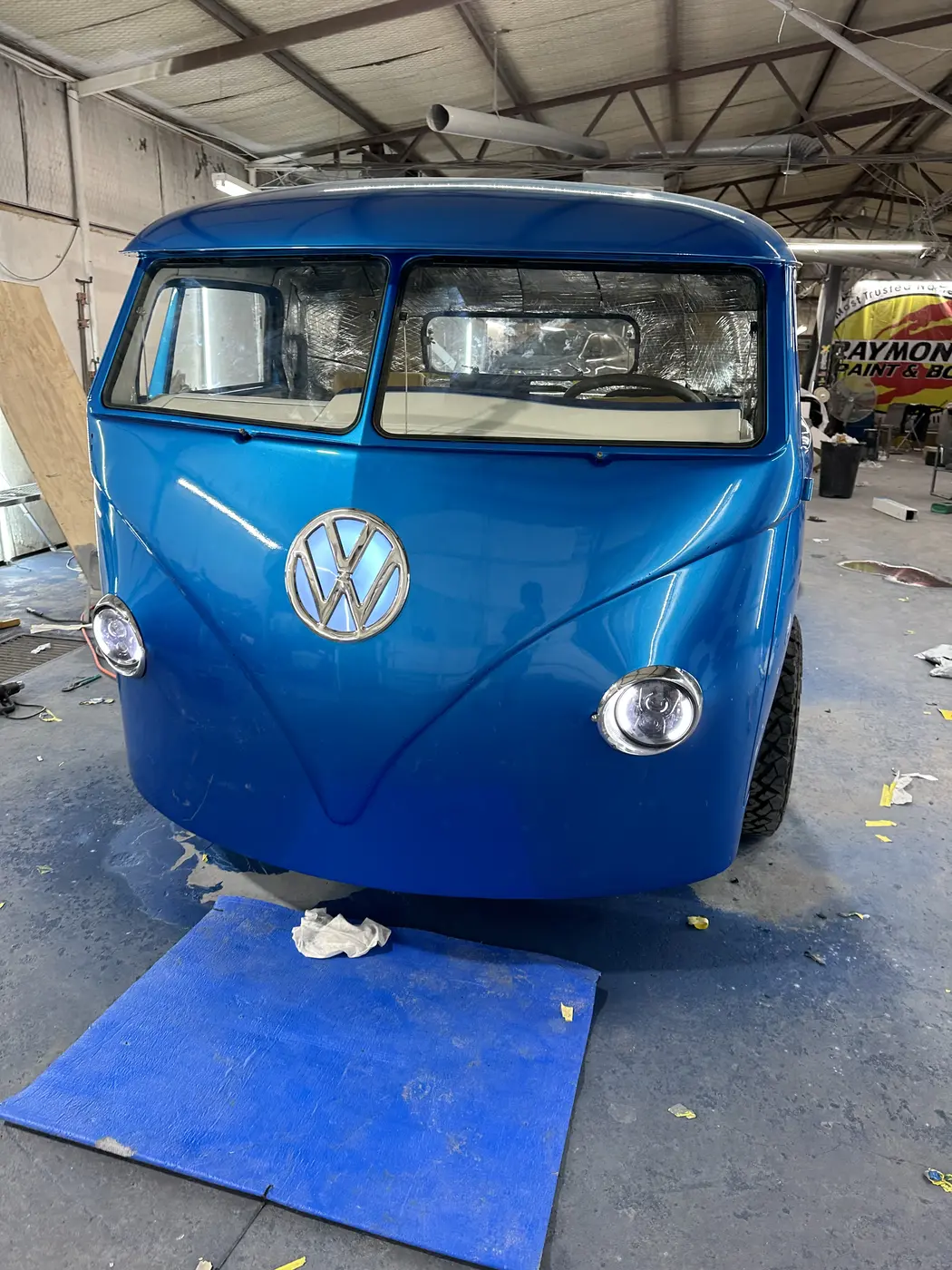 Blue painted VW cab during final assembly