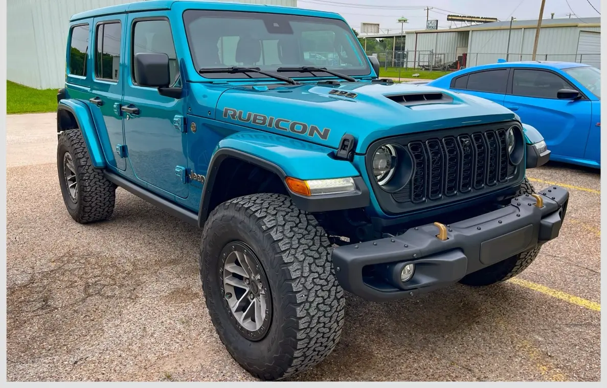 Blue Jeep Wrangler Rubicon restored after collision repair at Raymond's Paint & Body in Crowley, Texas